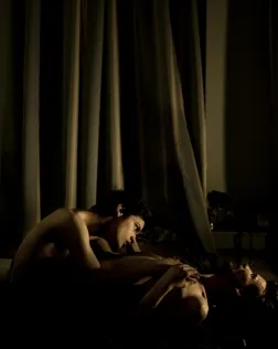 Jon and Alex, a gay couple, share an intimate moment at Alex’s home, a small apartment in St. Petersburg. Font: 