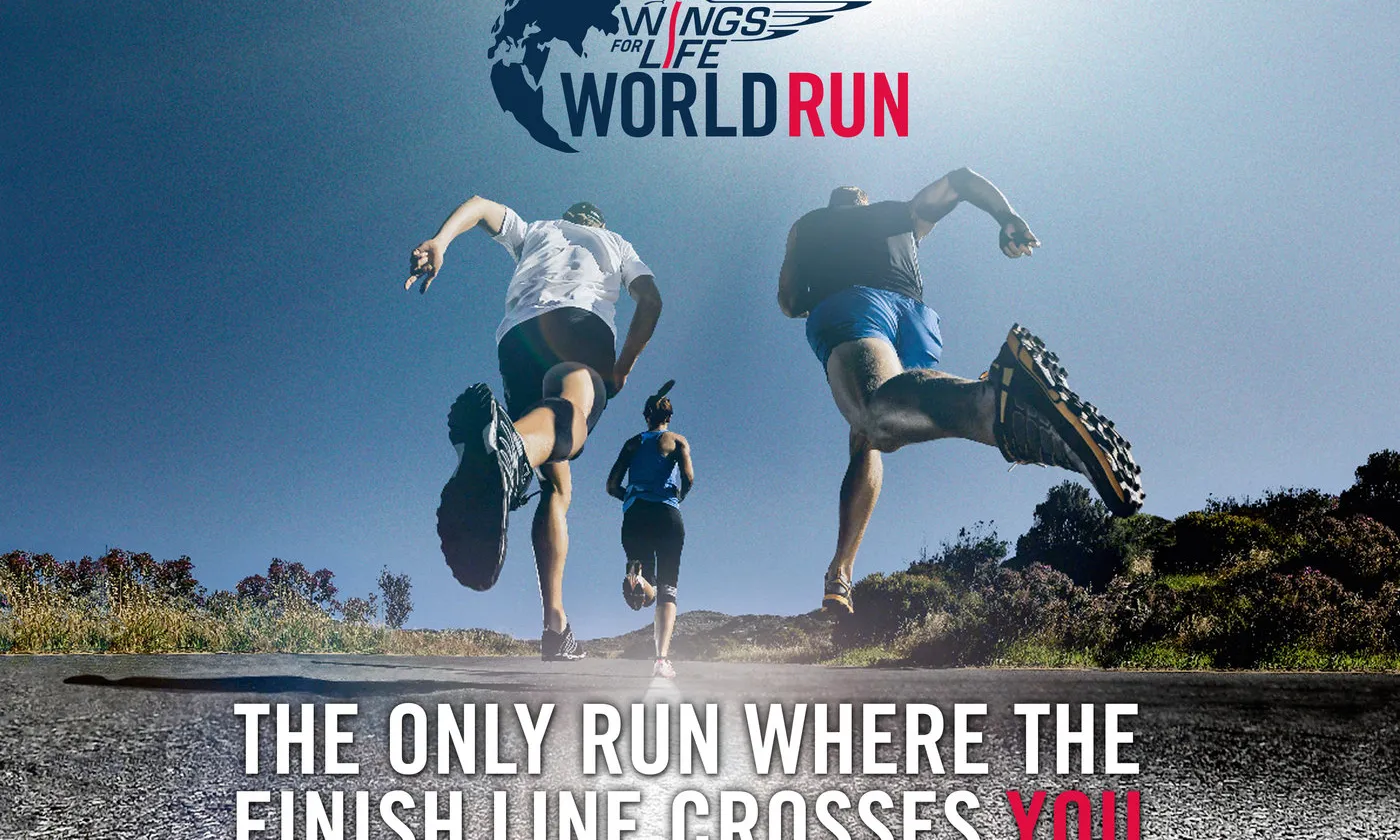 Un dels cartells de la Wings For Life World Run