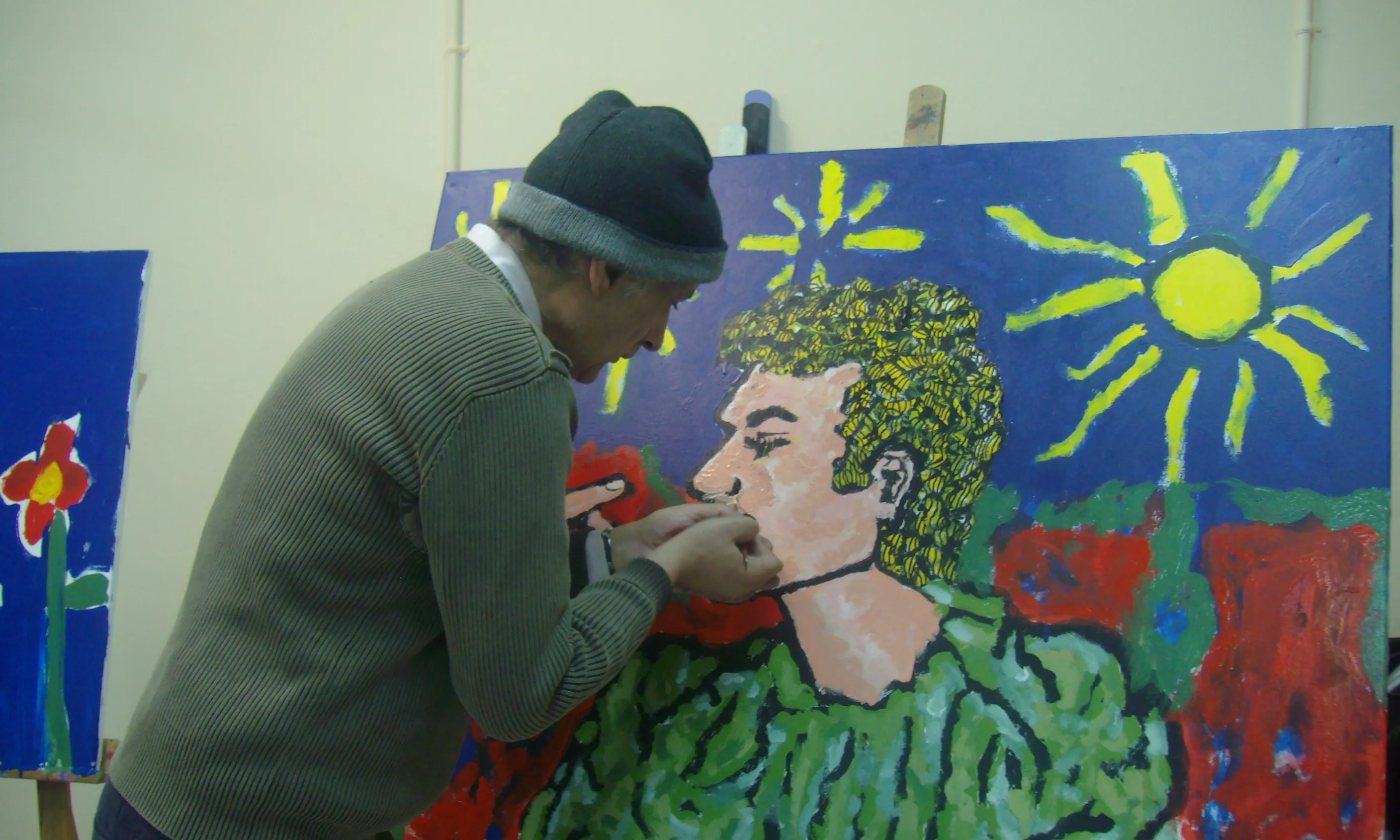 Persona pintant, activitat happening. Font: web de ARMPA
