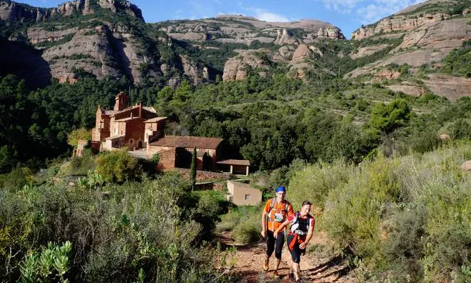 Dos corredors participen a la Primera Marató de Muntanya de Catalunya a l'edició del 2014.