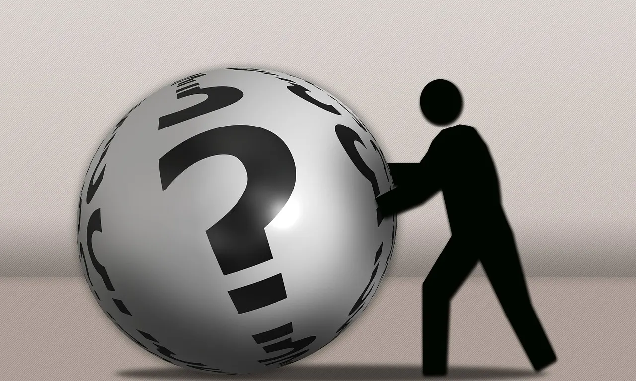 Home empenyent bola amb interrogants_font:pixabay