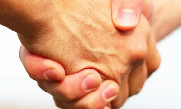 Símbol d'un acord. Font: dorsetcommunityfoundation.org